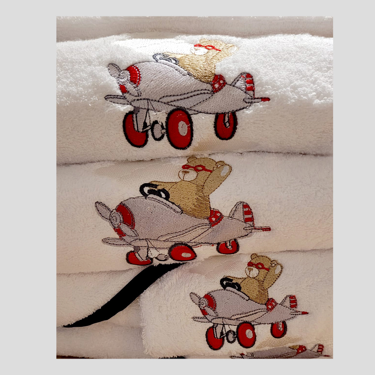 Linge de bain pour bébé en coton peigné avec broderie ours en avion