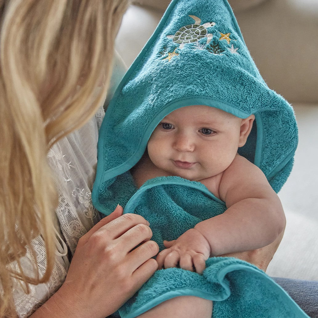 Combed cotton baby bath linen with embroidered fish