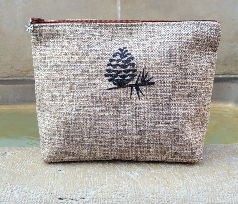 Trousse de toilette en tweed sérigraphiée