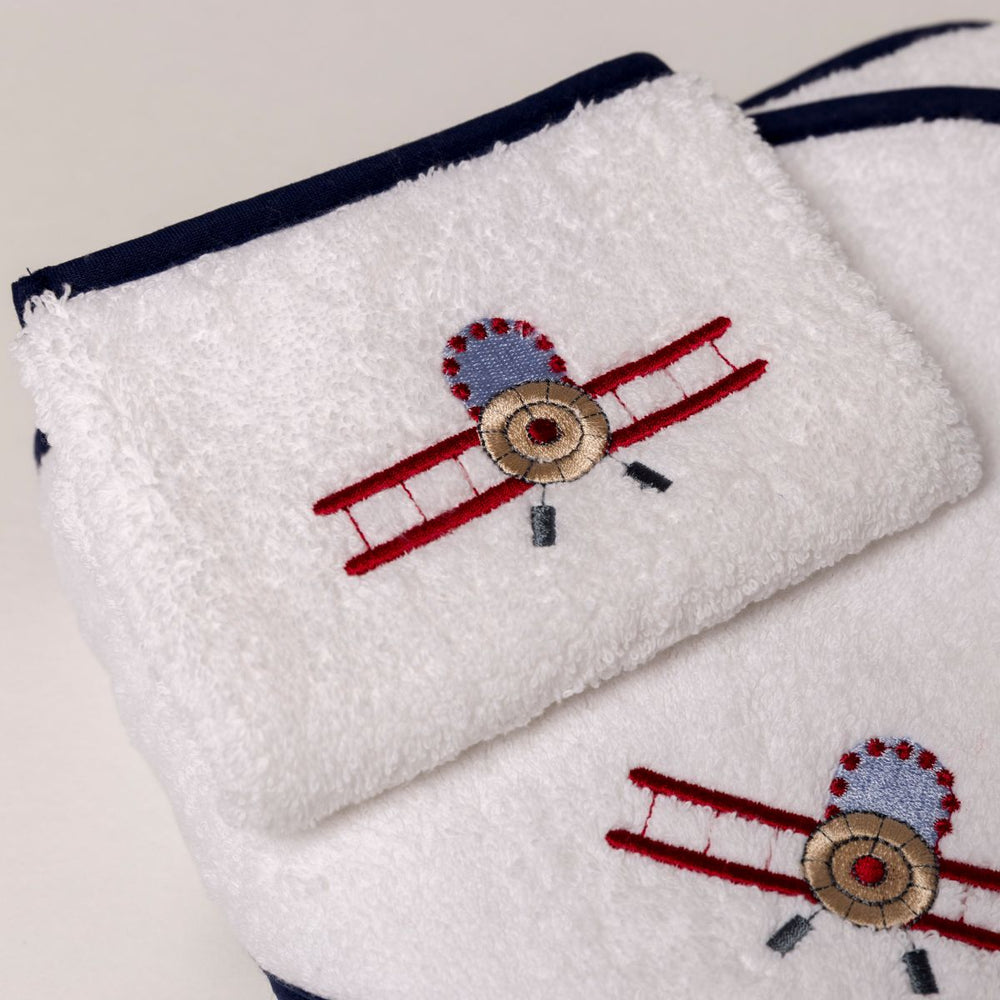 Combed cotton baby bath linen with embroidered airplane and car